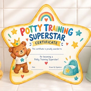 May include: A star-shaped Potty Training Superstar certificate featuring a brown bear wearing a gold crown and a white shirt with a blue star. The design includes a rainbow, colorful stars, hearts, and a blue potty illustration with text.