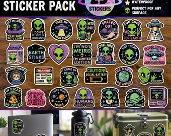 May include: A collection of 25 vinyl stickers featuring alien, UFO, and space-themed graphics with various humorous phrases. The stickers are displayed on a wooden surface, with additional examples shown on a laptop, water bottle, and cooler.