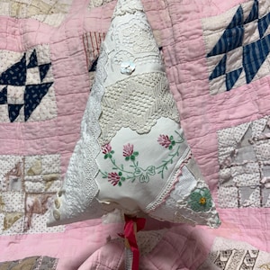 A decorative tree created from vintage linens, lace, buttons- things I’ve been holding on to. It’s fun repurposing some of these items.