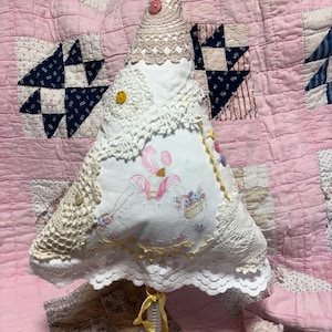 A decorative tree created from vintage linens, lace, buttons- things I’ve been holding on to. It’s fun repurposing some of these items.