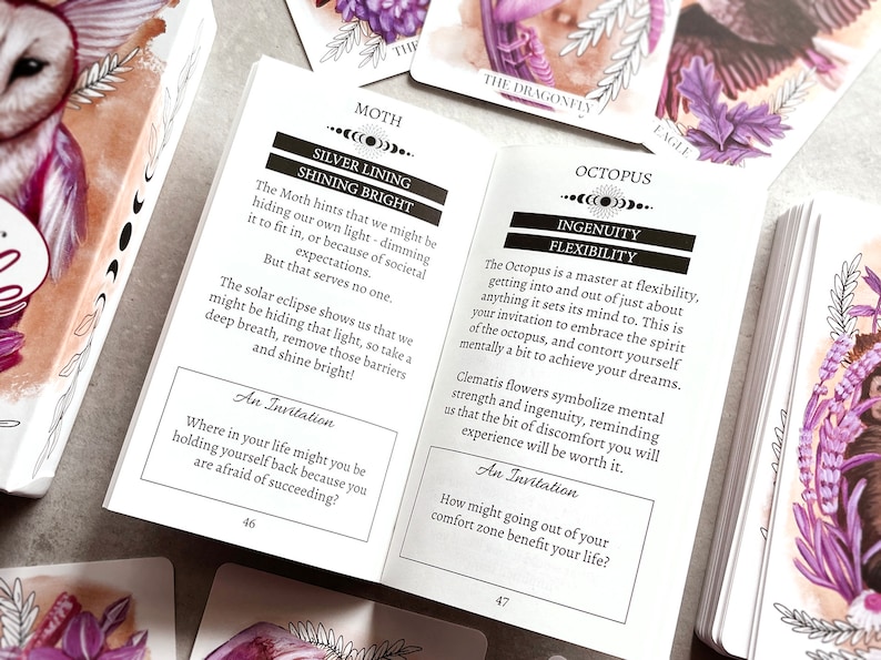May include: Two cards from a deck of oracle cards. The card on the left features a moth with a silver lining and the text "Silver Lining Shining Bright". The card on the right features an octopus with the text "Octopus Ingenuity Flexibility".