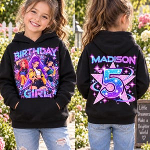 May include: A black hooded sweatshirt featuring a front graphic of three anime-style characters with the text BIRTHDAY GIRL. The back displays the name MADISON above a large glittery pink and blue star containing the number 5.