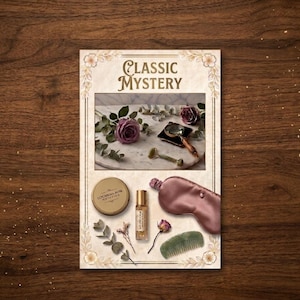 May include: A Classic Mystery themed gift set featuring a round gold tin, a small glass roller bottle, a mauve satin sleep mask, and a green comb. The set includes a decorative card with an image of purple roses, a magnifying glass, and a facial roller.