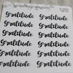 May include: Ten black and white stickers with the word "Gratitude" written in a cursive font. The stickers are on a white background.