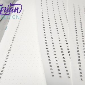 May include: A close-up of a white notebook with black numbers from 1 to 31 listed down the side of the page. The numbers are repeated multiple times across the page.