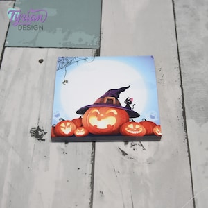 May include: A blue and white Halloween themed notepad with a cartoon image of a pumpkin wearing a witch's hat and a black cat sitting on top of the hat. There are other pumpkins around the main pumpkin.
