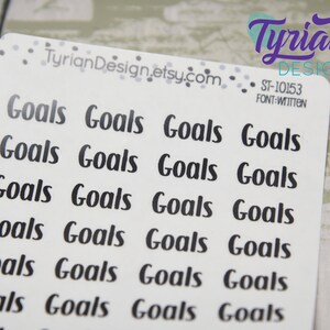 May include: White sticker sheet with the word "Goals" printed in a black, handwritten font. The sticker sheet has the text "TyrianDesign.etsy.com" and "ST-10153 FONT:WITTEN" printed on it. The stickers are arranged in rows.
