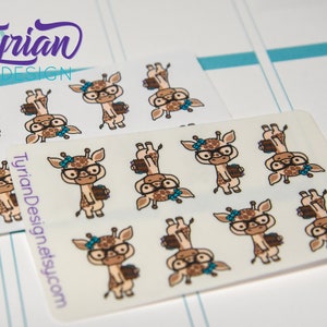 May include: Two sticker sheets featuring cartoon giraffes. The giraffes are wearing glasses and bows, and holding books and coffee cups. The stickers have a light brown and white color scheme. The text "Tyrion Design" and "TyrionDesign.etsy.com" are visible.