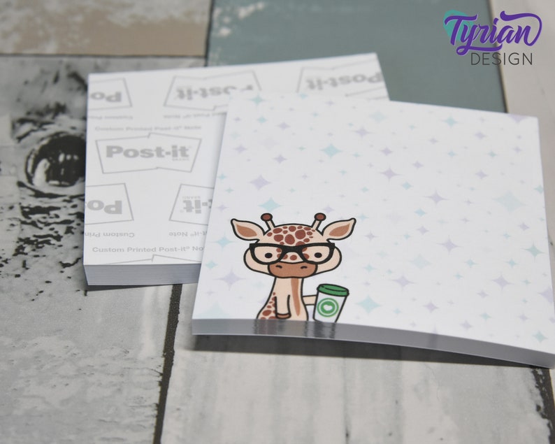 May include: A stack of white Post-it notes with a light blue background and a cartoon giraffe wearing glasses and holding a cup of coffee. The background has a pattern of light blue stars.