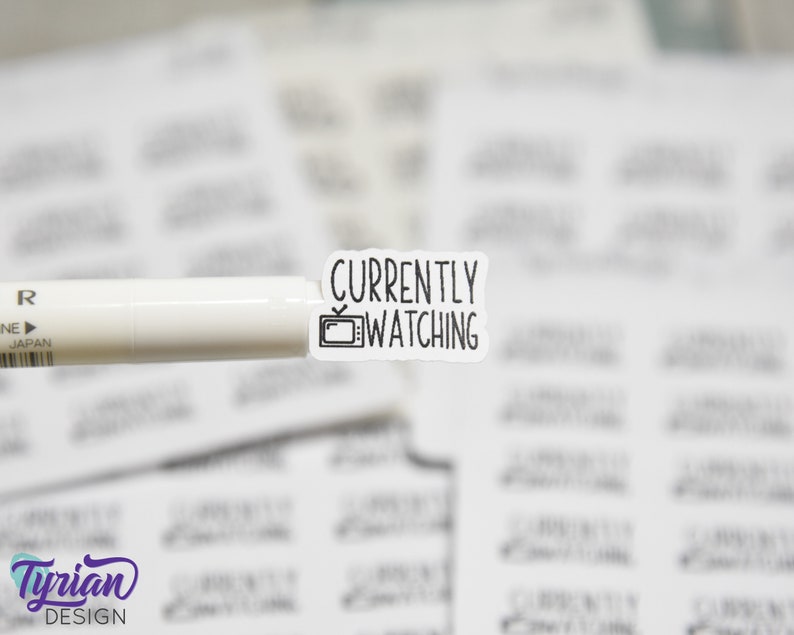 May include: A white sticker with black text that reads "Currently Watching" with a small television icon.