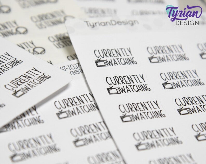 May include: A sheet of white stickers with the text "Currently Watching" and a small television icon. The stickers are designed for use in a planner or journal.