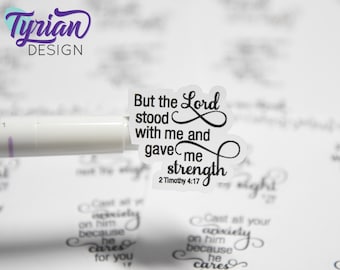 May include: A white sticker with black text that reads "But the Lord stood with me and gave me strength 2 Timothy 4:17".