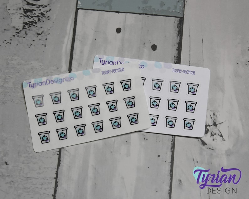 May include: Two sheets of stickers with a light blue background and white outlines. Each sheet has 16 stickers with a recycling symbol inside a small trash can. The text "teeny-recycle" is printed on each sheet.