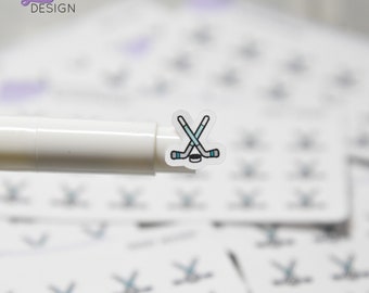 May include: A sheet of clear stickers with a hockey stick and puck design. The stickers are small and perfect for adding a touch of hockey spirit to your planner, laptop, or water bottle.