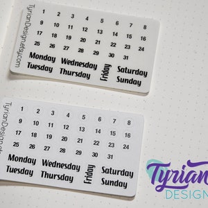 May include: Two sets of white calendar stickers with black numbers and days of the week. The first set has numbers 1-31 in a grid format. The second set has numbers 1-31 in circles. Both sets include the days of the week: Monday, Tuesday, Wednesday, Thursday, Friday, Saturday, and Sunday.