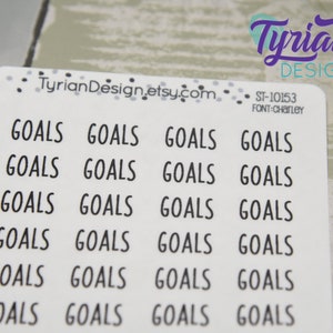May include: A sheet of white stickers with the word "GOALS" printed in a black, sans-serif font. The stickers are arranged in rows and columns. The top right corner has the text "Tyrian Design" in purple script.