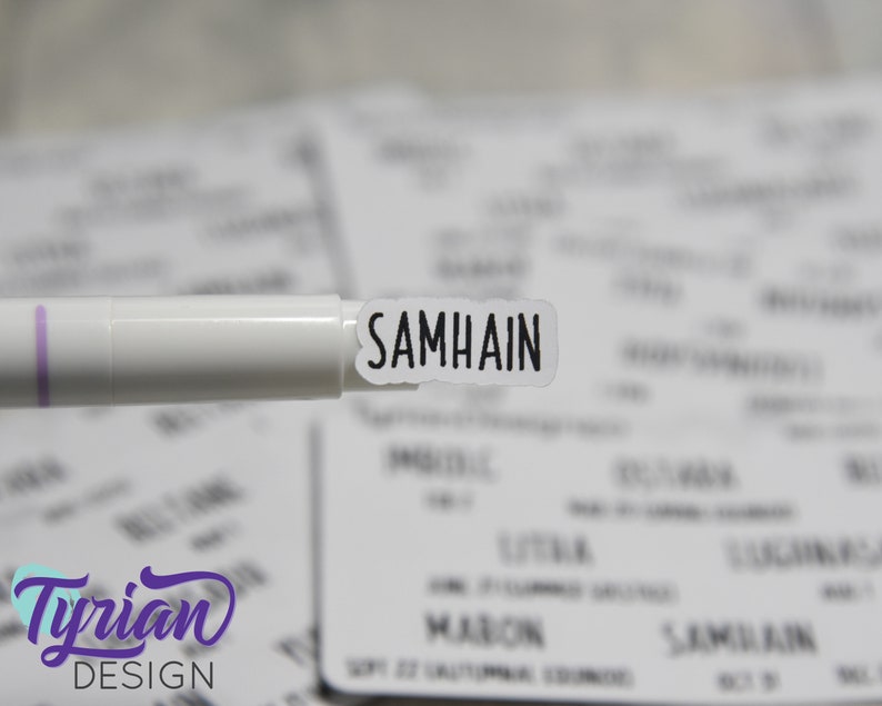 May include: A white sticker with the word "SAMHAIN" printed in black lettering.
