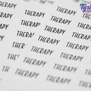 May include: A sheet of stickers with the word "Therapy" repeated multiple times in black text on a white background. The stickers are designed for use in a planner or journal.