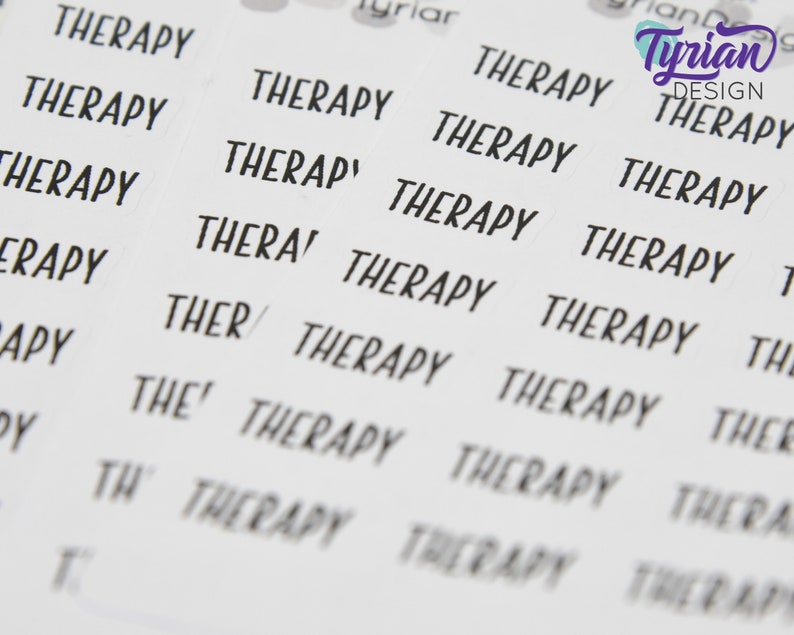 May include: A sheet of stickers with the word "Therapy" repeated multiple times in black text on a white background. The stickers are designed for use in a planner or journal.