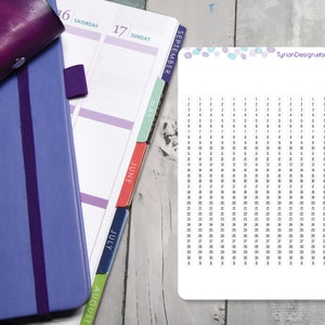 May include: A printable calendar sheet with a white background and black numbers. The calendar is for the year 2023 and is labelled "ST-10300 FONT-W". The top of the sheet has a light blue and purple confetti design. The text "TyrianDesign.etsy.com" is printed in the top right corner.