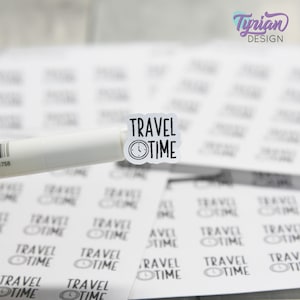 May include: A sheet of white stickers with the text "TRAVEL TIME" and a clock icon printed on each sticker.