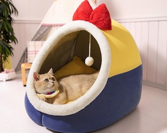 Söt kattgrottbädd med rosett, halvslutet husdjurshus, varm plyschkattkoja, avtagbar tvättbar kudde, halkfri inomhushundsäng, kattungebo