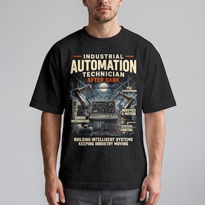 May include: A black t-shirt featuring a graphic print with the text Industrial Automation Technician After Dark. The design includes robotic arms, a control console, and labels for sensor integration, PLC programming, robotics, and system control.