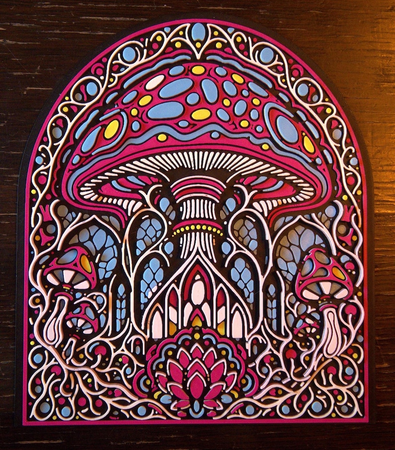 May include: A layered art piece featuring a large central mushroom with a pink cap and blue spots, surrounded by smaller mushrooms and intricate, arched architectural patterns in a vibrant color palette of pink, blue, yellow, and white.