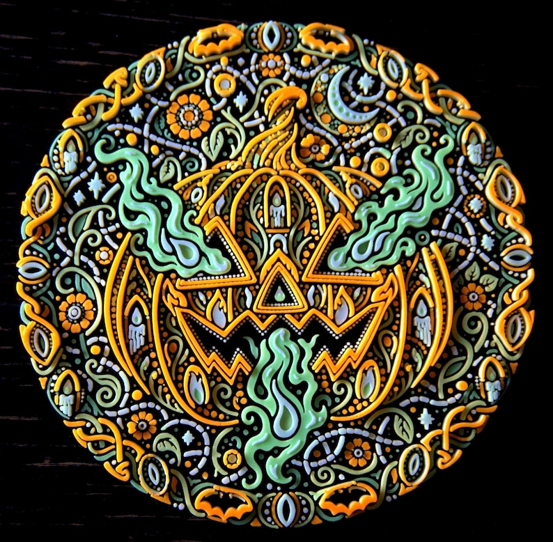 Jack o’ the Shadows circular jack-o’-lantern wall relief photographed in ordinary light, showing the complete design.