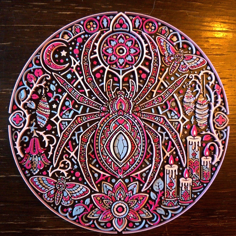 Arachnomancer circular spider wall relief photographed in ordinary light, showing the complete design.