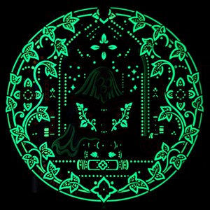 Dark-room view of Midnight Reader glow in the dark wall art