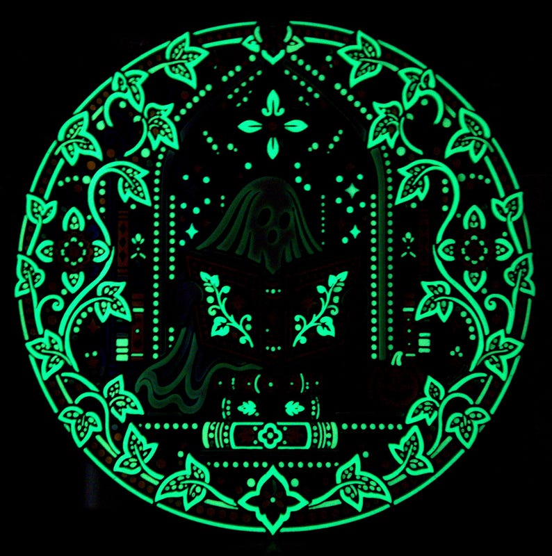 Dark-room view of Midnight Reader glow in the dark wall art