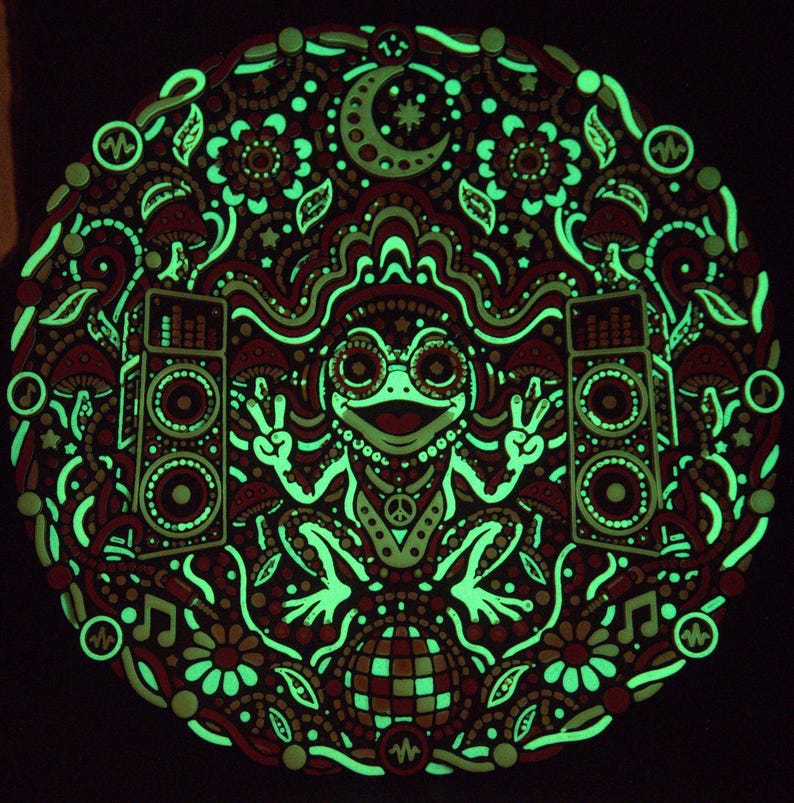 Bass Frog wall art showing its retained green glow in the dark after charging.