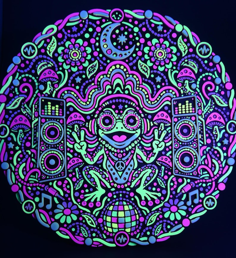 Full circular Bass Frog wall relief glowing in neon pink, yellow, and green under active UV blacklight.