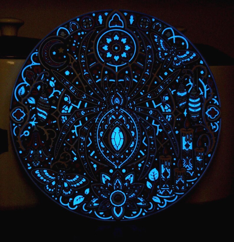 Complete Arachnomancer wall relief after the UV source is removed, showing retained afterglow.