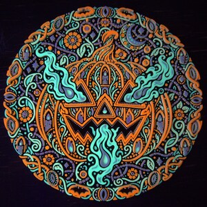 Complete Jack o’ the Shadows jack-o’-lantern wall relief under active UV blacklight.