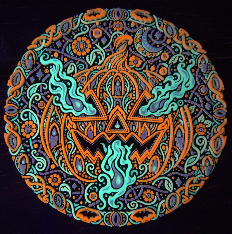 Complete Jack o’ the Shadows jack-o’-lantern wall relief under active UV blacklight.