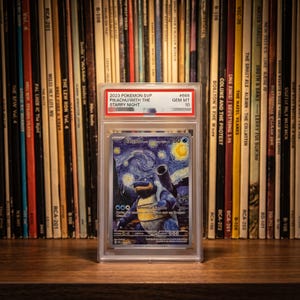 May include: A graded Blastoise trading card in a clear plastic slab. The card features a blue Blastoise character in a Starry Night art style. The label at the top reads 2023 POKEMON SVP PIKACHU/WITH THE STARRY NIGHT #666 GEM MT 10.