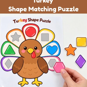May include: A Turkey Shape Matching Puzzle board featuring a brown cartoon turkey with colorful tail feathers, each containing a shape outline. The text Turkey Shape Puzzle is printed at the top. Loose shapes include a yellow square, orange star, and purple diamond.
