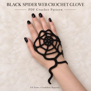 May include: A black crochet spider web hand accessory featuring a central web design that covers the back of the hand and extends into a wrist strap. The text reads BLACK SPIDER WEB CROCHET GLOVE, PDF Crochet Pattern, US Terms, Confident Beginner.
