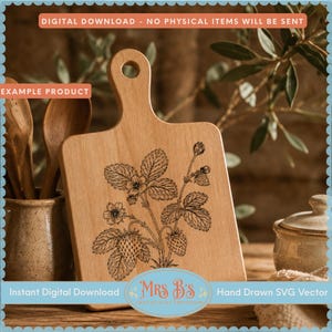 May include: A light-colored wooden cutting board with a handle featuring a black line art illustration of a strawberry plant with leaves, flowers, and berries. The board is rectangular with rounded corners and a circular hole in the handle.
