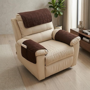 May include: A cream-colored leather recliner chair featuring a dark brown quilted fabric cover set. The cover set includes a headrest protector and two armrest covers, with the left armrest cover featuring integrated storage pockets.