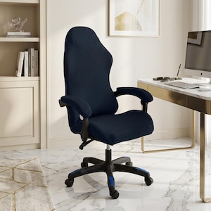 May include: A navy blue office chair featuring a textured, stretchable fabric cover that fits over the backrest, seat, and armrests. The chair has a black five-point base with rolling casters and blue accent details on the legs.