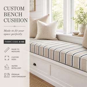 May include: A custom bench cushion featuring a beige and navy blue striped pattern, placed on a white wooden bench with drawers. The text reads CUSTOM BENCH CUSHION, Made to fit your space perfectly, FABRIC CODE: A-148, MADE TO MEASURE, CUSTOM SIZES, WATER REPELLENT, and PREMIUM CRAFTSMANSHIP.