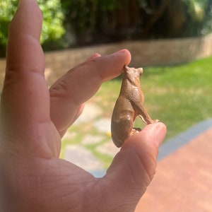 Miniature German Shepherd Satue or Sculpture. Carved from a solid block of Walnut. This Figurine is in a Sitting pose.