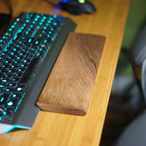Wooden keyboard wrist rest. With an angled notch for acute angle keyboards. Ergonomic. Can help prevent carpal tunnel