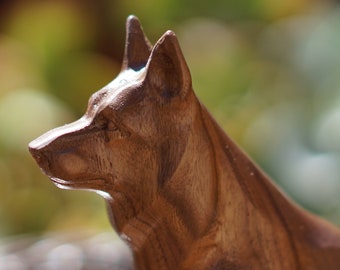 German Shepherd Statue or Sculpture. Carved from a solid block of Walnut. This Figurine is in a Sitting pose. Available in different sizes.