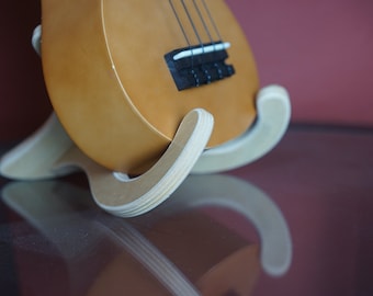 Plywood ukulele stand. 2 peices slide into place to make a sturdy base for your ukulele or small guitar.