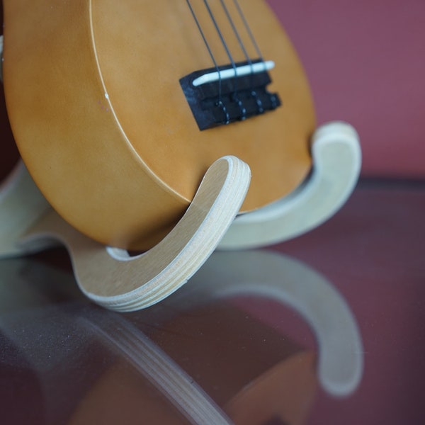 Plywood ukulele stand. 2 peices slide into place to make a sturdy base for your ukulele or small guitar.