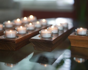 Any size wooden candle holder. Is Reversible! Great for any occasion. Made of Walnut. Can be used to light Shabbat Candles.